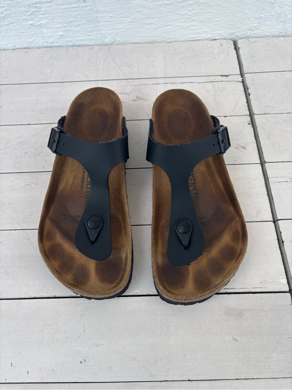 Birkenstock Black T-Strap Sandals with Brown Footbed